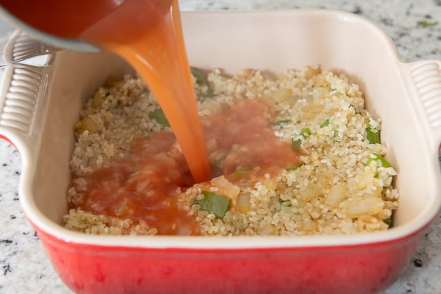 Easy Arroz Con Pollo Recipe - With Tomato Beer Broth Poured Into Dish
