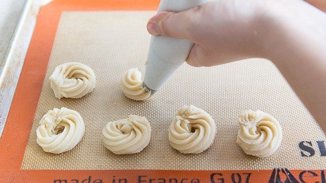 Piping Swirls of Butter Shortbread Dough Onto Silicone Mat