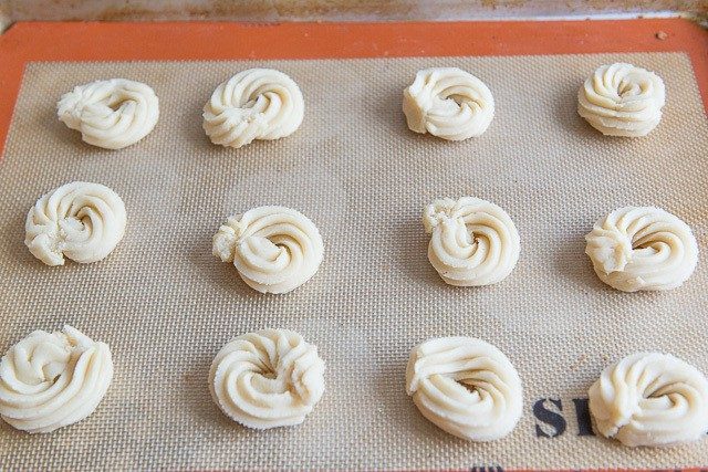 Piped Swirled Circles of Dough on Silicone Mat Unbaked