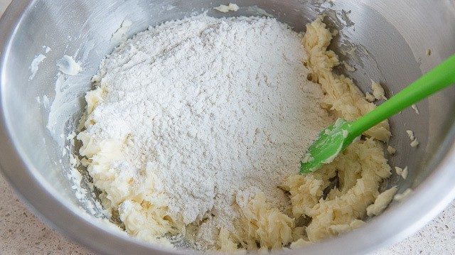 Adding Flour to Creamed Butter and Sugar in Mixing Bowl