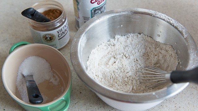 Mixing Bowl with Flour, Cinnamon, and Baking Powder Whisked Together
