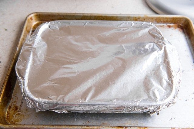 Casserole Dish Covered with Foil on Sheet Pan