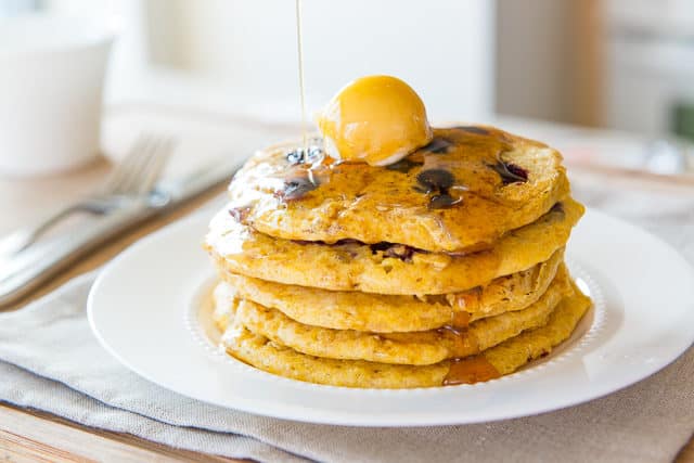 Cornmeal Pancake Recipe - Served Stacked On a Plate with Butter and Maple Syrup