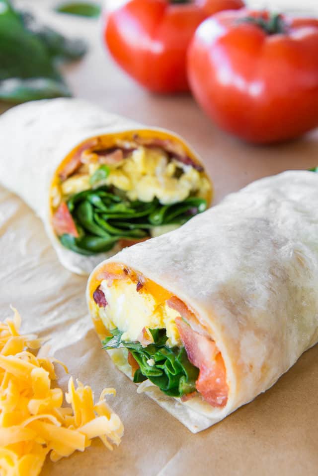 Breakfast Burrito Recipe - Served on Parchment Paper and Showing Filling Inside