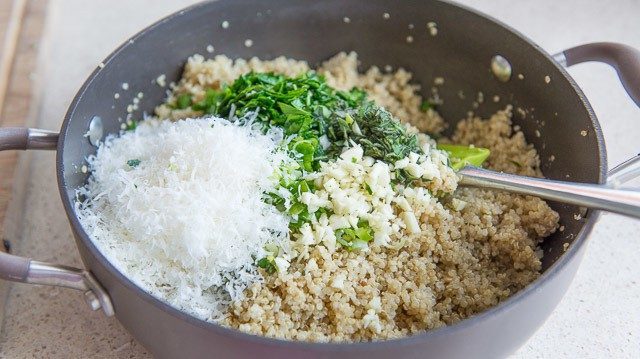 Grated Cheese and herbs In Cooked Quinoa Pan