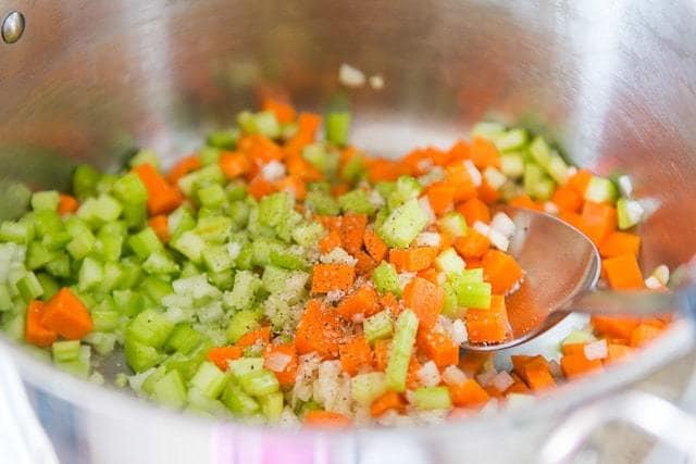 Chopped Onion, Celery, and Carrot in Soup Pot with Spoon