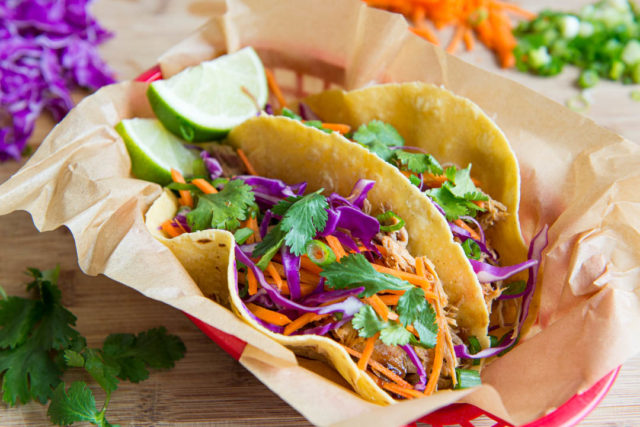 Slow Cooker Asian Pork - Stuffed Into a Taco with Slaw and Lime Wedges
