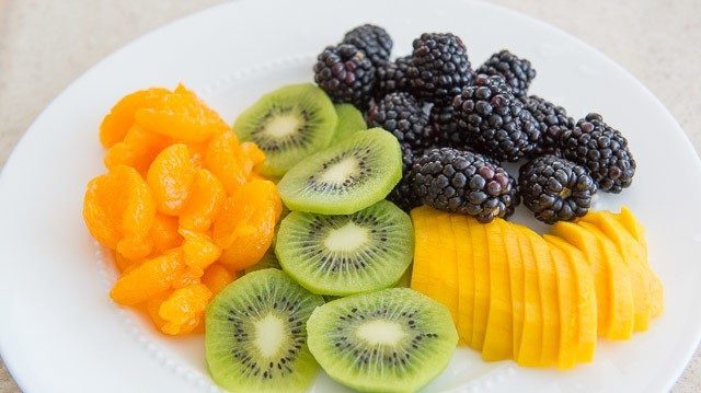 Mandarin Oranges, Kiwis, Blackberries, and Mango on a Plate