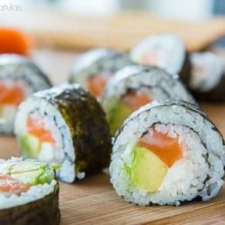 Homemade Sushi Slices on Wooden Board