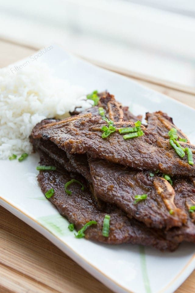 Kalbi Beef - Stacked on a Platter with Green Onion and Rice