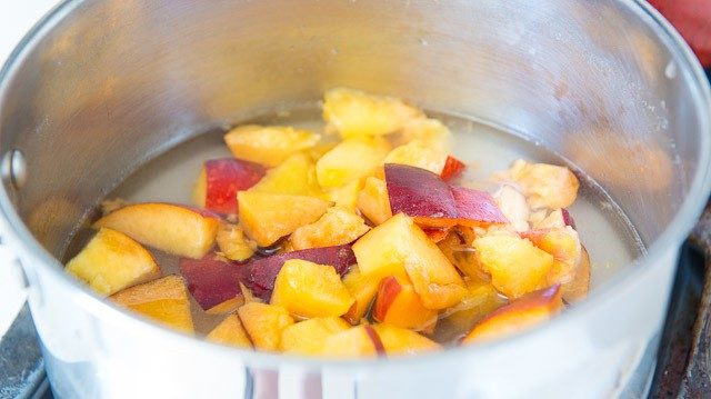 Chopped Fresh Peaches in Pan with Sugar and Water