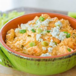 Crockpot Buffalo Chicken Dip in Bowl with Blue Cheese Crumbles On Top