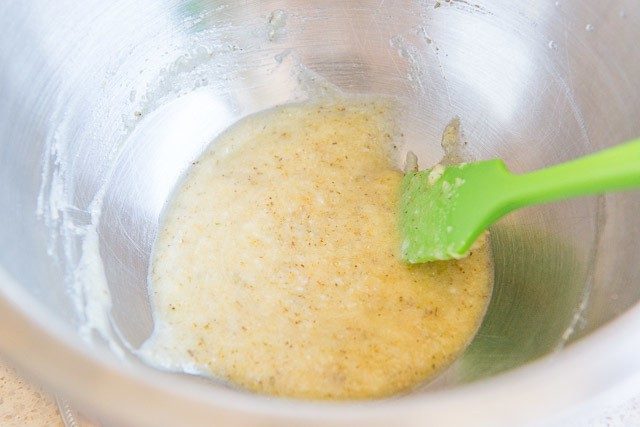 Garlic Parmesan Sauce - In a Mixing Bowl with Green Spatula