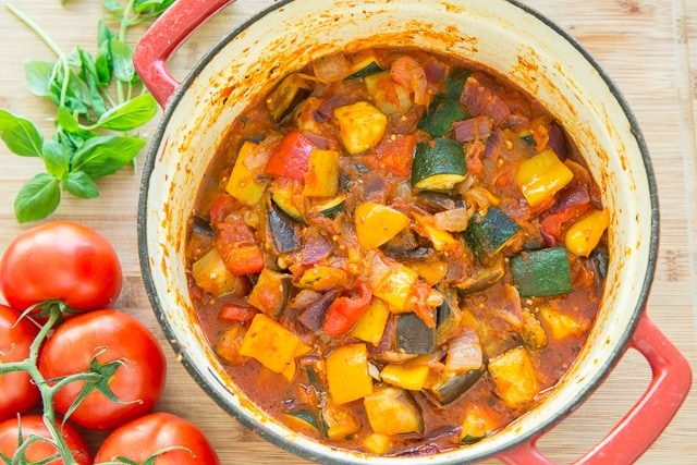 Ratatouille Dish - With Eggplant, Zucchini, Bell Peppers, Onions, and Tomato Stewed in Red Dutch Oven