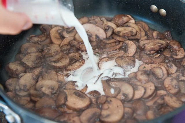 Pouring Thickening Liquid Into Mushroom Sauce