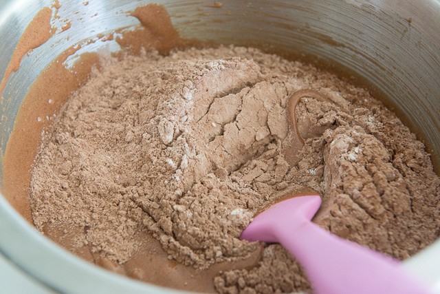 Wet Ingredients for Brownies In bowl with Cocoa Mixture On Top