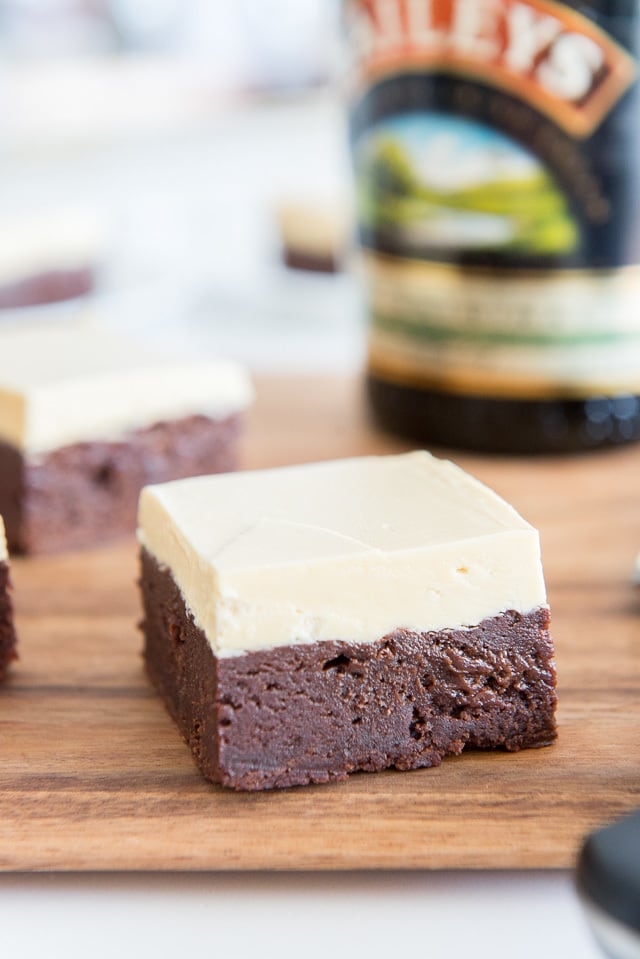 Irish Cream Brownies - In Squares on Wooden Board with White Chocolate Buttercream