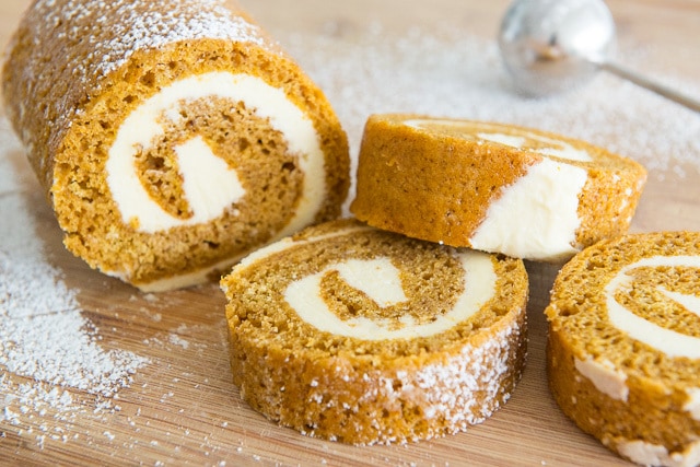 Pumpkin Roll - On a Wooden Board with Partial Loaf and Slices