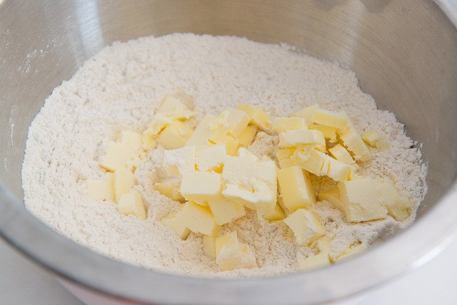 Butter Cubes On Top of Flour Mixture in Bowl