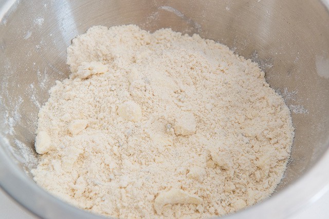 Butter Cubes Worked Into Flour Mixture in Bowl