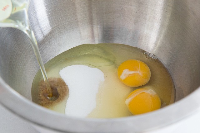 Pouring Oil Into Bowl with Eggs, Sugar, and Vanilla