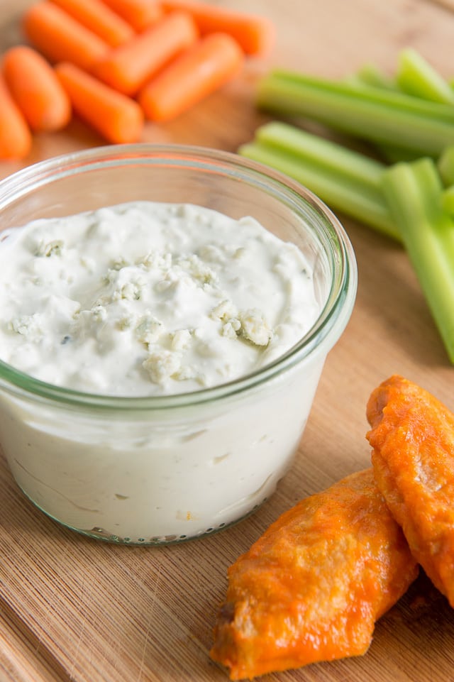 Blue Cheese Dip - On a Wooden Board with Wings, Celery, and Carrot Sticks