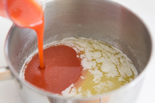 Melted Butter and Frank\'s Hot Sauce Pouring Into Pan