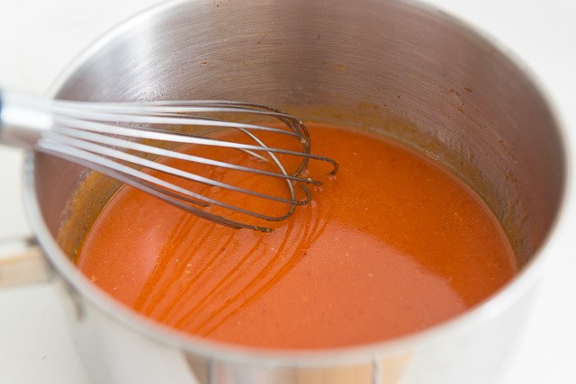 Hot Wing Sauce in Saucepan with Whisk