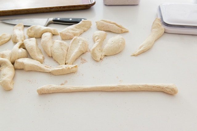 Rolled and Cut Pieces of Pizza Knot Dough on Countertop