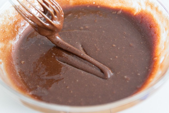 Whisk Showing Thick Brownie Batter Mixture