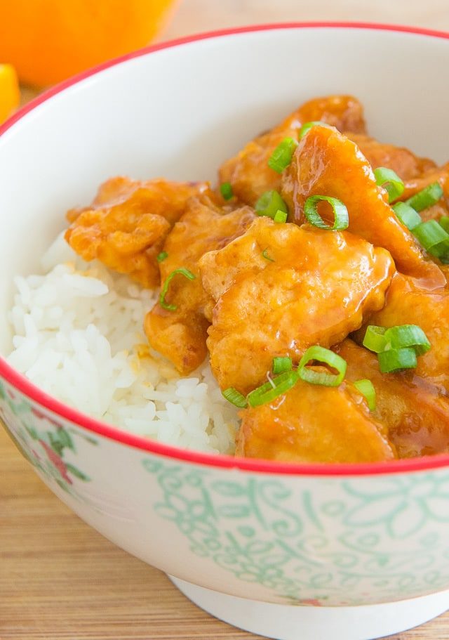 Orange Chicken - Garnished with Scallions in a Bowl with White Rice