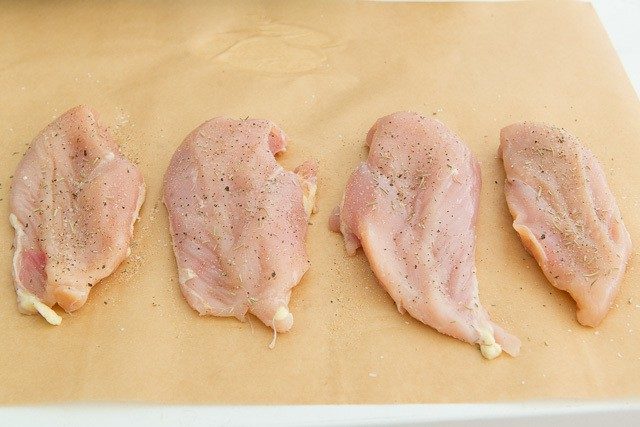 Seasoned Chicken Breasts on Parchment Paper