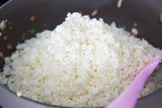 Cauliflower Rice Added To Pan in Big Pile