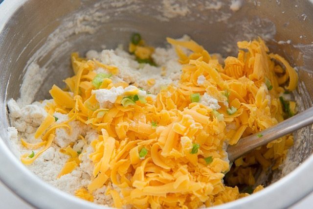 Cheddar Cheese Shreds and Green Onion in Dry Ingredients Bowl