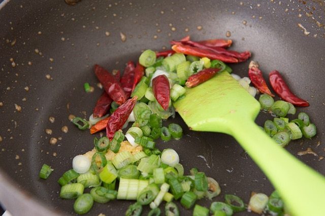 Dried Red Chiles and Scallions in Skillet