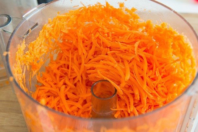 Shredded Fresh Carrots in Food Processor Bowl