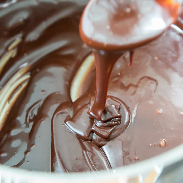 Homemade Hot Fudge Sauce Drizzling Down Into pan