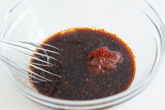 Soy Sauce and Gochujang in Mixing bowl with Whisk
