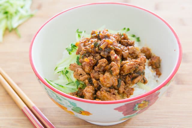 Asian Ground Chicken over Shredded Cucumber and Rice in Bowl