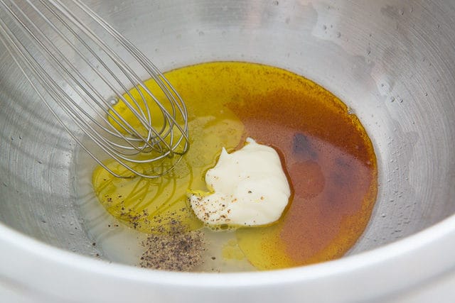 Olive Oil, Mayonnaise, and Spices in Bowl with Whisk
