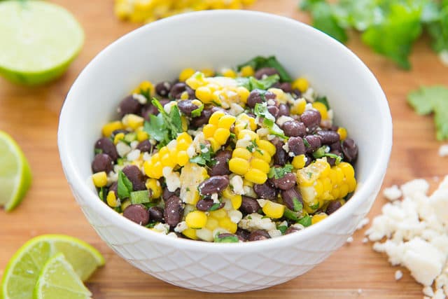 Black Bean and Corn Salad - in White Bowl with Herbs and Lime
