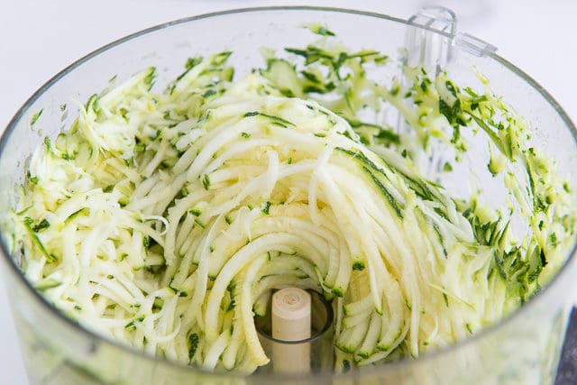 Shredded Zucchini in Food Processor Bowl