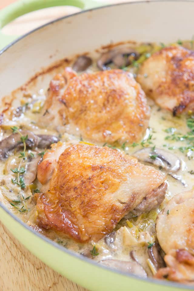Creamy Parmesan Chicken - In a Green Braiser Dish with Mushrooms and Thyme
