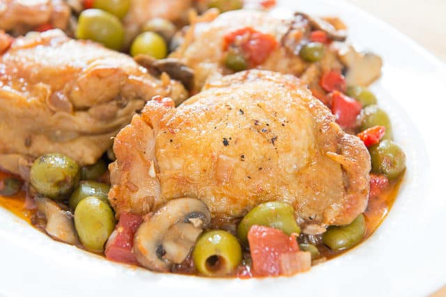 Chicken Cacciatore Recipe - On a White Platter with Olives and Tomatoes