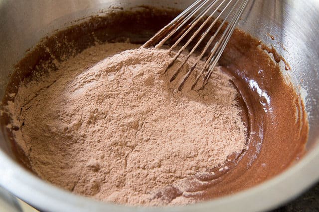 Adding Cocoa Powder Dry Ingredients To Chocolate Cookie Wet Ingredients