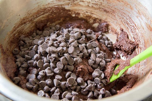Stirring Semisweet Chocolate Chips Into Chocolate Cookie Dough 