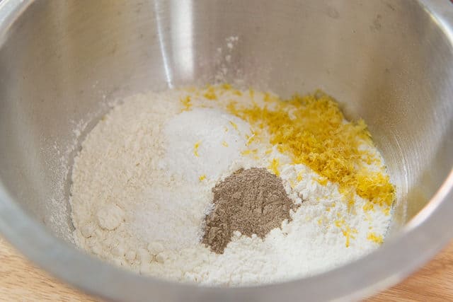 Dry Ingredients For Lemon Crinkle Cookies With Flour, Baking Powder, Cardamom, Sugar, Salt, Lemon Zest