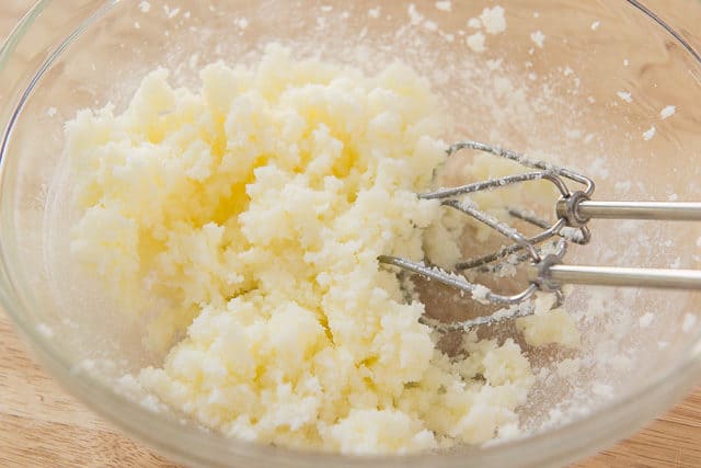 Creamed Butter And Sugar In Duralex Glass Mixing Bowl With KitchenAid Hand Mixer Beaters