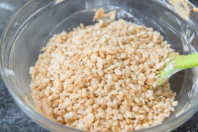 Adding Crisp Rice Cereal from Trader Joe's into Peanut Butter Bon Bon Mixture