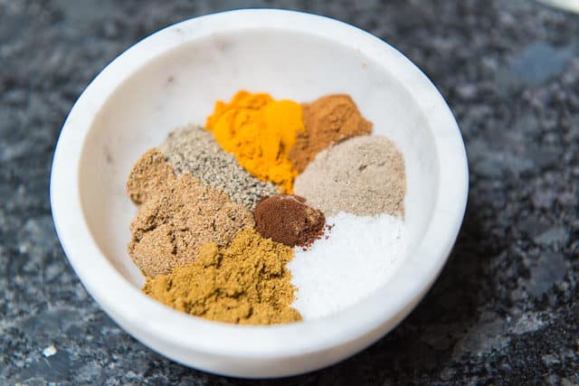 Indian Style Spices in White Marble Pinch Bowl: Turmeric, Cumin, Coriander, and More